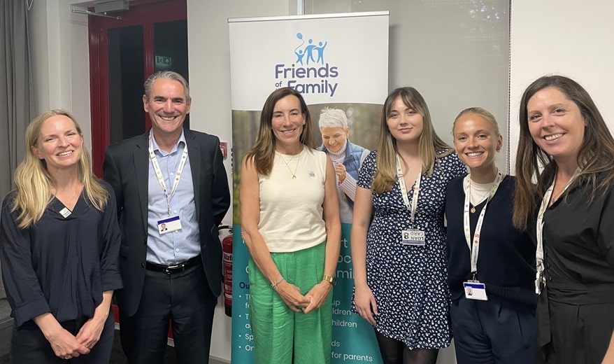 Blake Morgan's Family law team in front of the Friends of the Family charity banner at the quiz.