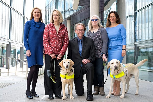 Outside the Blake Morgan Cardiff office with Guide Dogs Cymru in 2019